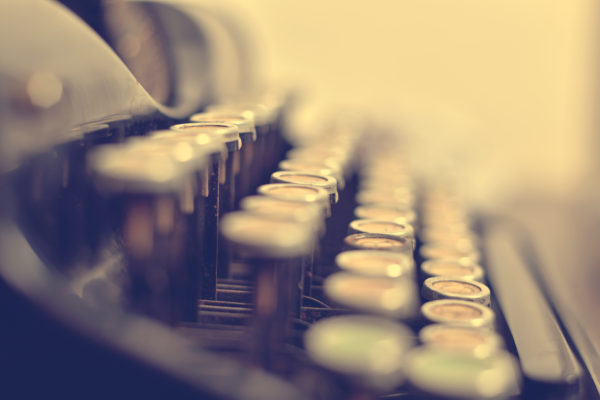 Old typewriter keyboard in vintage color tone